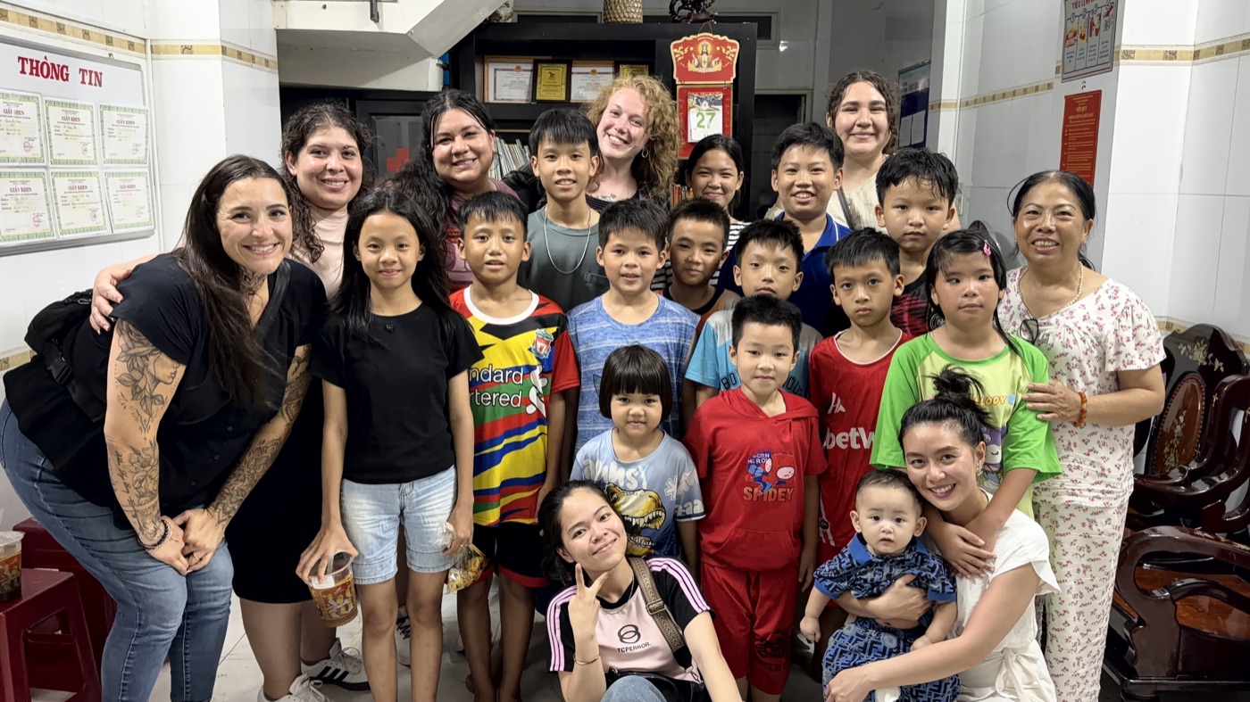 The team with local children in Vietnam
