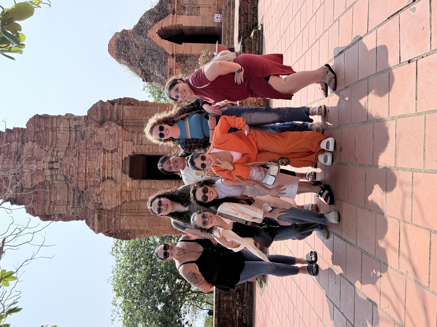 The team gathered at a historic Cham temple